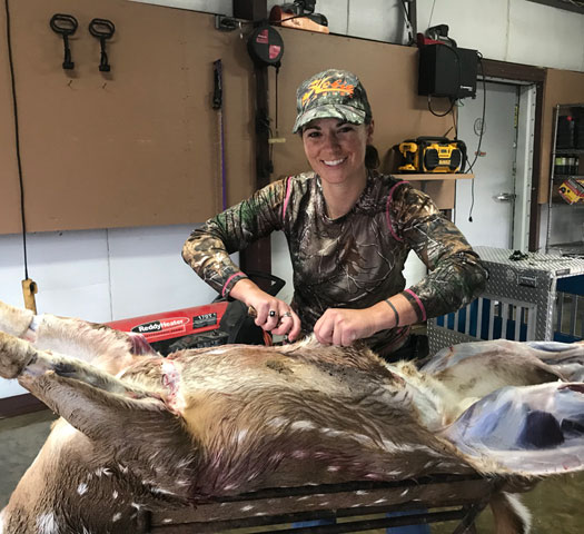 Martha Spencer cleaning a deer after the hunt